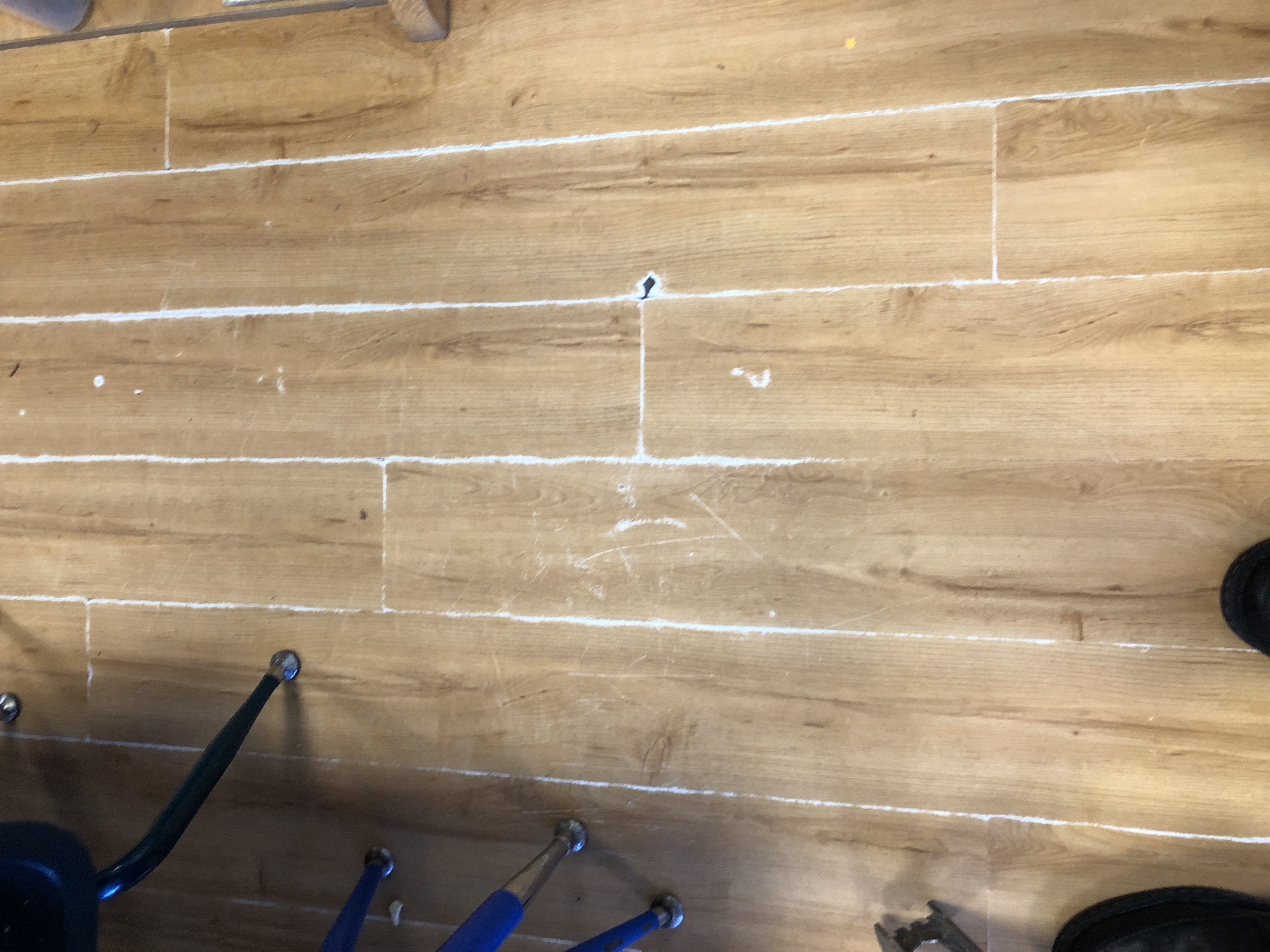 Wear in laminate wearlayer. Flooring Inspectors